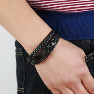 Men's punk black braided leather multi-layer bracelet with skull charm on wrist