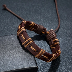 Retro punk hand-woven leather bracelet in dark brown with adjustable cord on black box