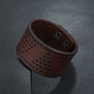 Retro punk wide brown leather bracelet with perforated design and snap button closure