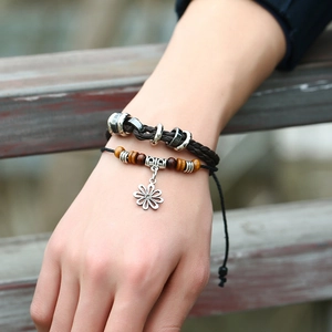 Retro multi-layer braided leather bracelet with wooden beads and silver flower charm
