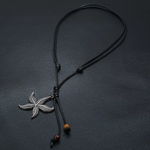 Ethnic starfish pendant on long black wax cord with colorful bead accents