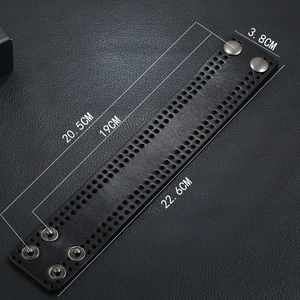 Detail view of 3.8CM wide black leather punk bracelet with multi-size snap closures