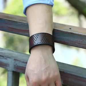 Retro punk style dark brown wide leather bracelet with decorative triangular punch holes