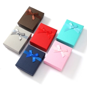 Close-up of assorted rectangle jewelry gift boxes with elegant ribbon bow textures