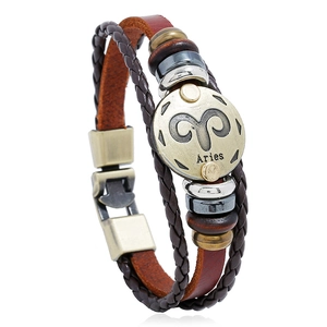 Detail of Aries zodiac vintage multilayer leather bracelet with bronze metal charm
