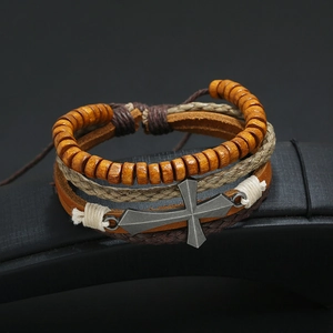 Retro multi-layer leather bracelet set with wooden beads and metal cross on black stand