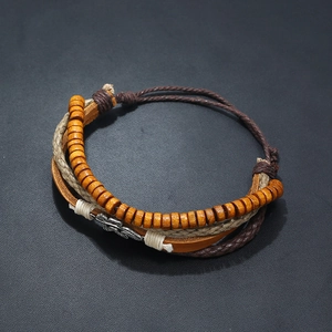 Retro multi-layer leather bracelet set with wooden beads and alloy feather charm