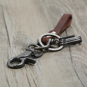 Vintage leather and alloy keychain with industrial rustic metal hooks and brown cowhide loop