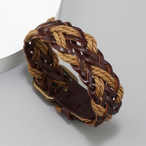 Macro view of hand-woven PU leather bracelet with retro brass buckle and hemp rope