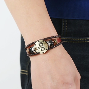 Handmade layered leather Aries zodiac bracelet with vintage beads and woven cords