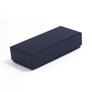 Detail of navy blue rectangular jewelry gift box with matte textured finish for keychains