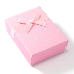 Rectangle pink jewelry gift box with textured finish and elegant satin ribbon bow