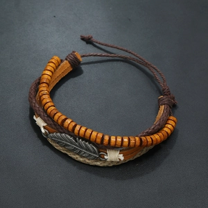 Retro multi-layer leather bracelet with wooden beads and silver metal feather charm
