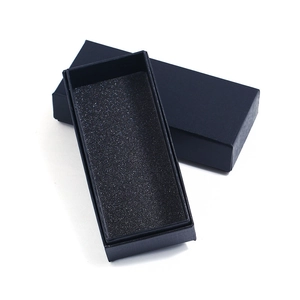 Navy blue rectangular gift box with textured finish and black foam insert for jewelry