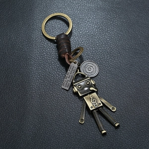 Retro bronze robot keychain with braided leather strap and engraved metal plate