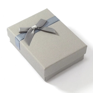 Elegant light gray jewelry gift box with satin ribbon bow for rings and necklaces