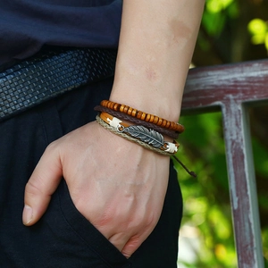 Multilayer leather bracelet with vintage silver leaf pendant and brown wooden beads