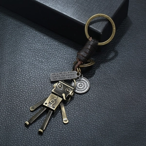 Vintage punk robot keychain in bronze metal with leather weave and engraved quote tag