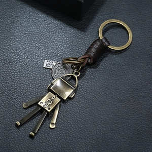 Retro handmade braided leather keychain with vintage bronze robot and musical G-clef charm