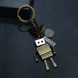 Handmade leather punk robot keychain with vintage bronze metal and spring limb details
