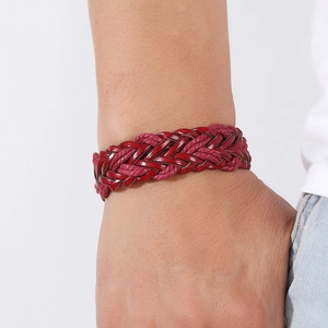 Detail of multi-layer hand-woven burgundy PU leather bracelet on a model's wrist