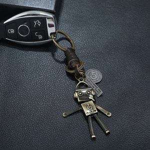 Vintage bronze robot keychain with braided leather strap and heart-themed metal tag