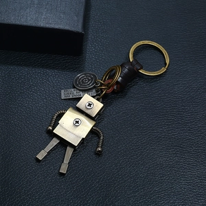 Punk vintage handmade woven leather keychain featuring an industrial bronze robot charm