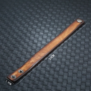 Detail view of vintage brown leather bracelet with adjustable snaps and size dimensions