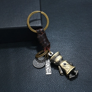 Punk woven leather keychain with vintage alloy zombie pendant and engraved quote tag