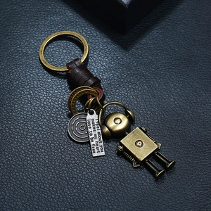 Retro punk handmade leather keychain with movable bronze robot and engraved tag