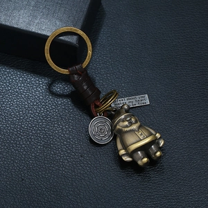 Retro handmade leather keychain with bronze alloy charms and vintage weave detail