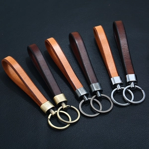 Minimalist genuine leather keychains in brown and tan with varied metal ring finishes