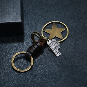Vintage handmade brown leather keychain with bronze star charm and engraved metal tag