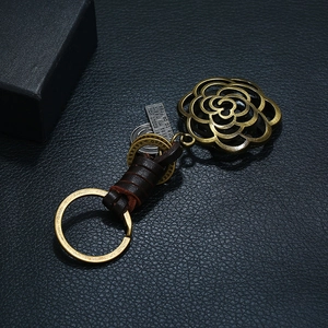Retro handmade leather keychain with bronze rose pendant and engraved metal plate