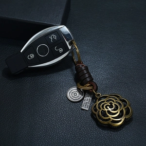 Retro handmade braided leather keychain with brass rose charm and metal tags
