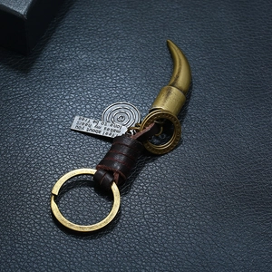 Punk vintage braided cowhide keychain with brass ox horn pendant and metal charm