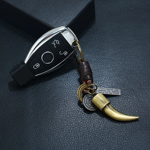 Vintage punk woven leather keychain with a retro bronze horn pendant and car key remote case