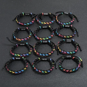 12-piece set of woven zodiac bracelets with rainbow ribbons and black buckle connectors