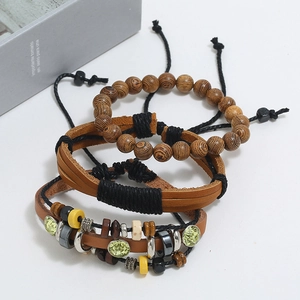 Three-piece vintage leather and wood bead bracelet set with woven details and green stone