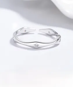 Detailed view of 925 silver geometric rhombus ring with wave patterns and zircon stones
