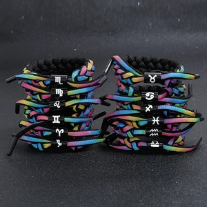 Rainbow braided shoelace bracelet set featuring twelve zodiac signs with metal sliders