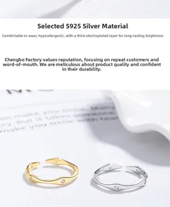 Detailed view of wave-shaped S925 silver rings with zircons in gold and silver finish