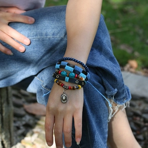 Multilayer bohemian braided leather bracelet set with blue beads and ethnic pendant