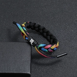 Detail of hand-woven Scorpio zodiac bracelet with rainbow pattern and black clasp