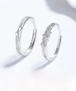 Macro shot of S925 sterling silver butterfly couple rings with sparkling zircon inlay