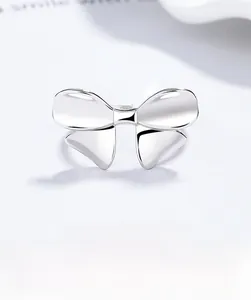 Macro shot of 925 sterling silver bow ring featuring a polished finish and engraved S925 stamp