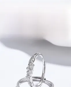 Macro shot of 925 sterling silver butterfly ring with cubic zirconia and floral details