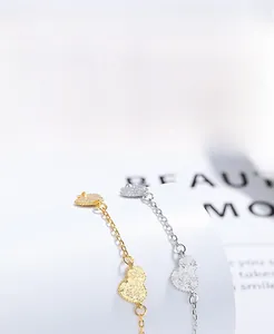 Macro detail of S925 sterling silver heart charms with thick electroplating for durability