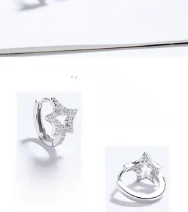 Detailed macro view of S925 sterling silver star hoop earrings with sparkling zircon inlay