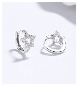 Detailed macro shot of 925 silver star hoop earrings with sparkling cubic zirconia inlay